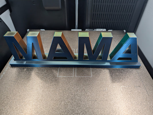 Finished multicolor MAMA shelf sitter on the 3D printer build plate